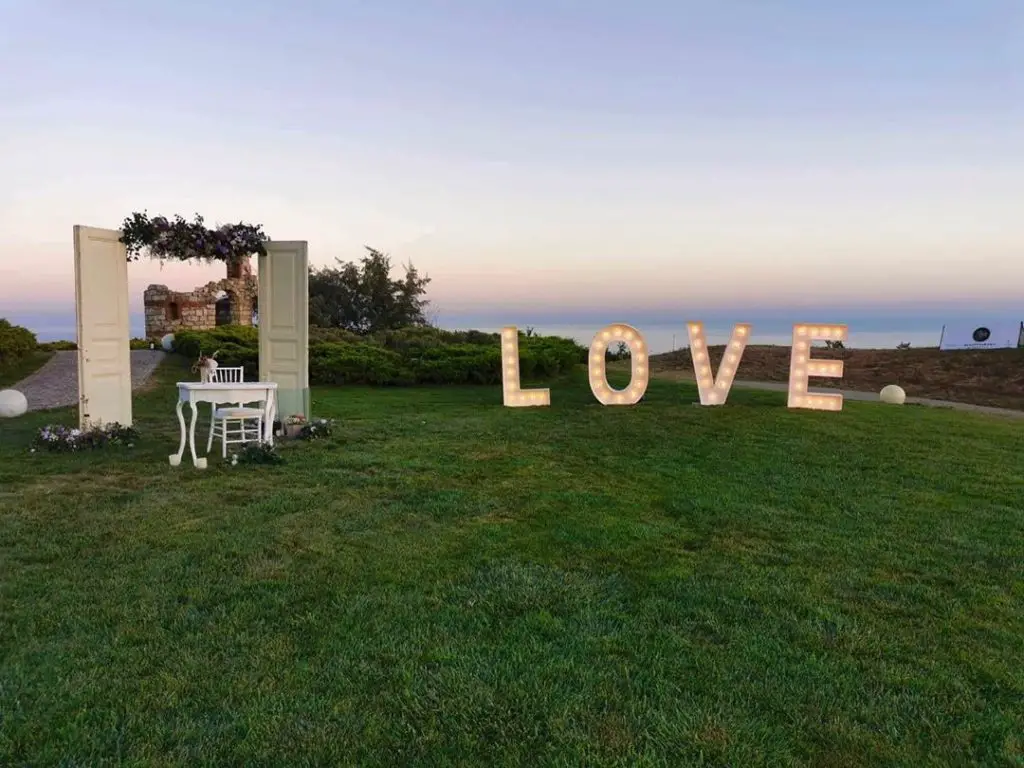 Golf Themed Wedding Ideas & Inspiration.  Big love sign and decorative door arch