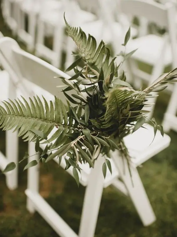 DIY Backyard Wedding Decorations On a Budget greenery aisle chairs decor