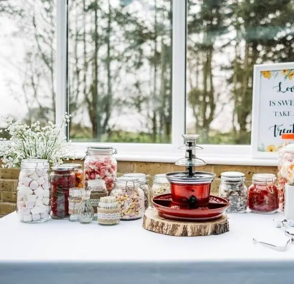 DIY Backyard Wedding Decorations On a Budget Sweets Table Jars 