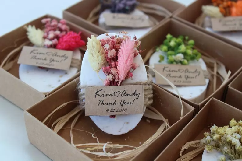 handmade soap with dried flowers and tag in a box. Inexpensive Spring Wedding Favors Under 2$