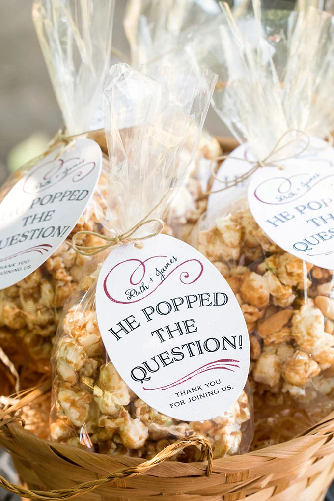 Wedding Favors Under $1 DIY Caramel Corn packaged in cellophane with tags. 