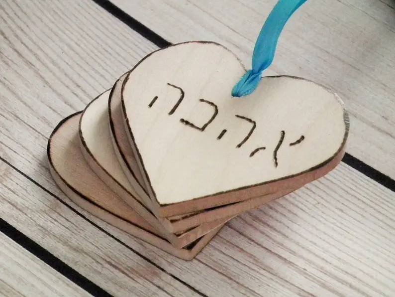 Best Jewish Wedding Favor Ideas Your Guests will Love - wooden heart tags with the Hebrew word 'love'