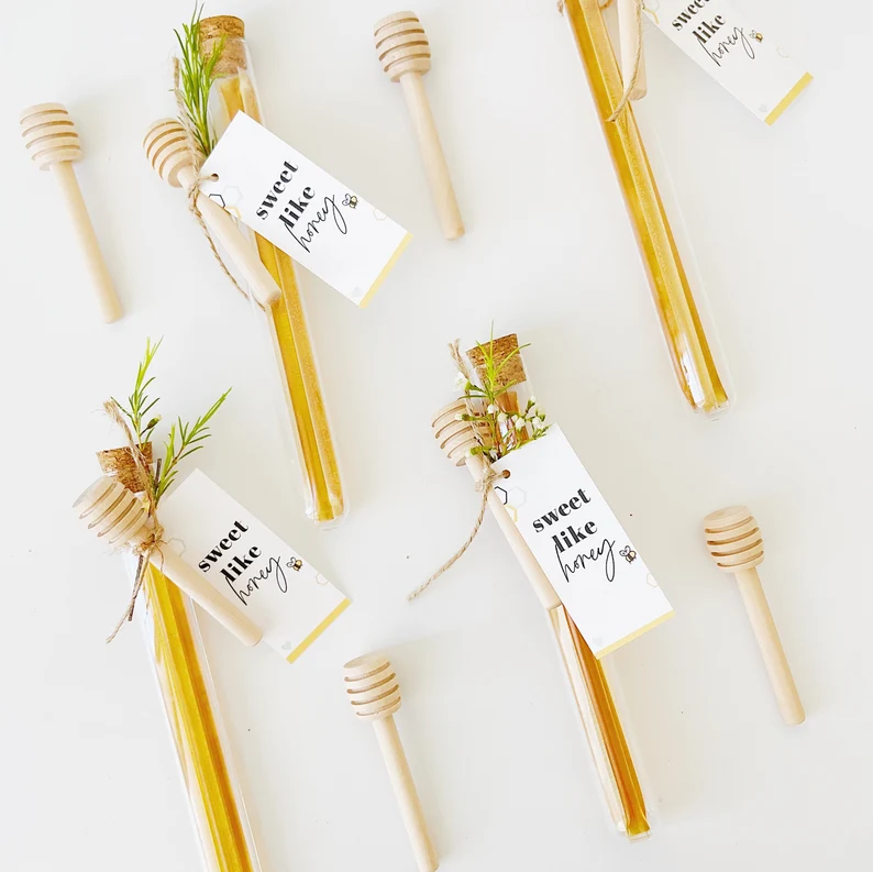 honey in glass tubes with honeycomb sticks and tags. Cheap DIY Bridal Shower Favors.